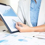 leader business woman discussing the charts and graphs showing the results