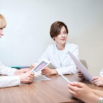 Colleagues of reproductologists gathered for a medical consultation