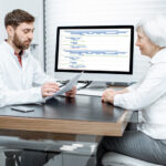 Senior woman with doctor in the office